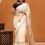 Timeless Cream Mul Saree with Pink Floral Buttis and Silver Border Detail